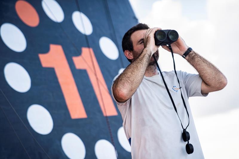3 February 2023, Leg 2, Day 10 onboard 11th Hour Racing Team. Charlie Enright looks through the binoculars for Biotherm and Holcim, somewhere on the horizon - photo © Amory Ross / 11th Hour Racing / The Ocean Race
