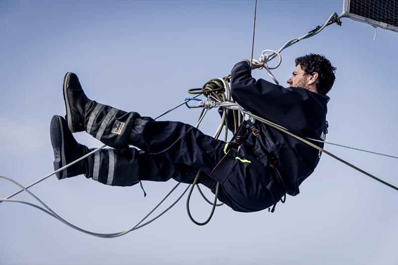 8 February 2023, Leg 2, Day 15 onboard Biotherm. Anthony Marchand cleaning the lazy sheet mess - photo © Anne Beauge / Biotherm