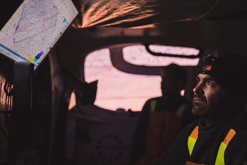08 February , Onboard 11th Hour Racing Team during Leg , Day 15. Charlie Enright analyzing the options at sundown - photo © Amory Ross / 11th Hour Racing Team