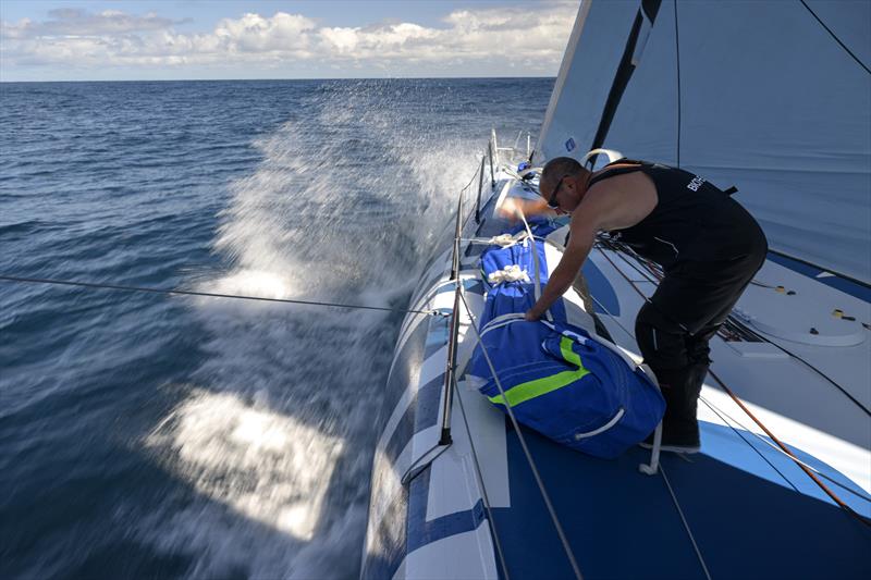 The Ocean Race 2022-23 Leg 3, Day 1 onboard Biotherm. Damien Seguin working on the sails at the bow photo copyright Ronan Gladu / Biotherm taken at  and featuring the IMOCA class