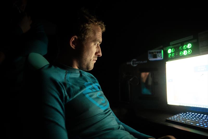 The Ocean Race 2022-23 Leg 3 Day 2, onboard Holcim - PRB Team. Sam Goodchild on his computer - photo © Julien Champolion | polaRYSE / Holcim - PRB