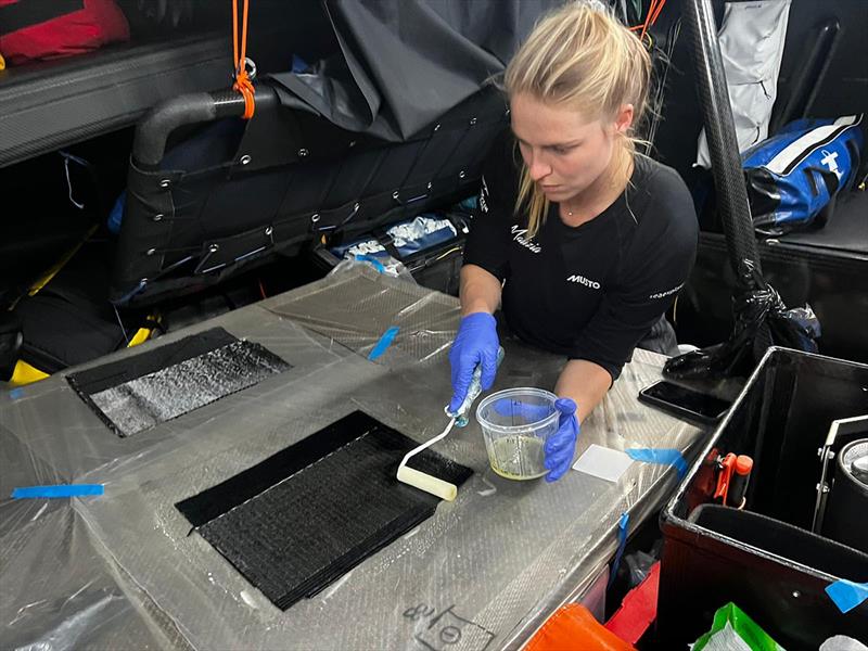 Image of Rosalin Kuiper preparing the carbon laminate stacks for Will Harris to apply to the mast - photo © Antoine Auriol