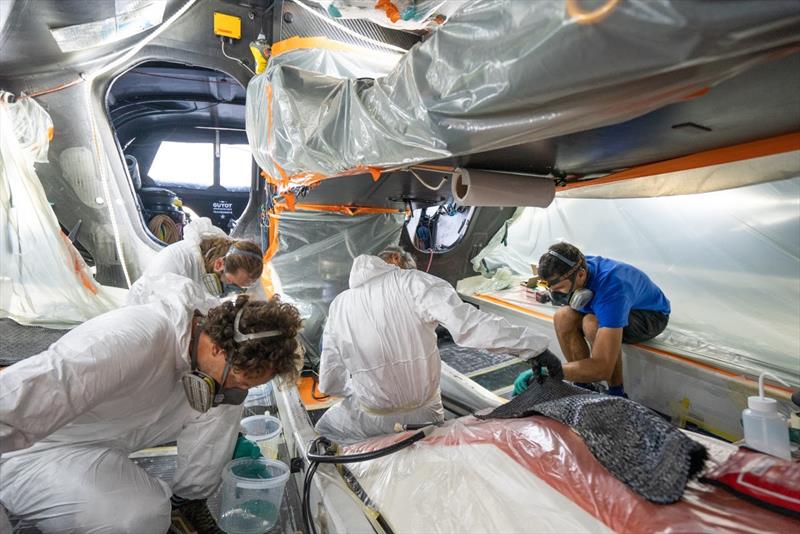 The Tech Team is working hard to re-laminate the damage in the hull photo copyright Charles Drapeau / GUYOT environnement - Team Europe taken at  and featuring the IMOCA class