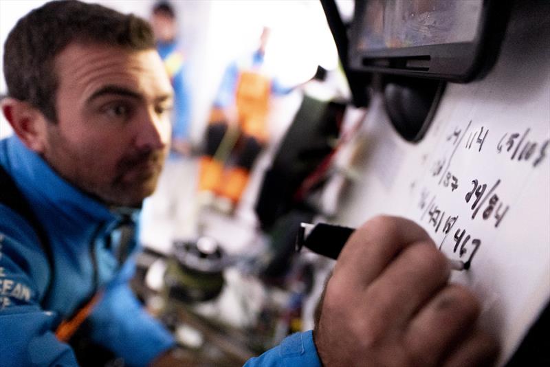 The Ocean Race 2022-23 Leg 3 onboard 11th Hour Racing Team. Charlie Enright writes down the sched scores on the board - photo © Amory Ross / 11th Hour Racing / The Ocean Race