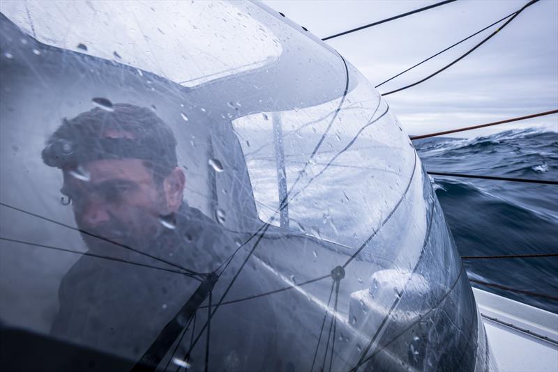 The Ocean Race 2022-23 Leg 3 onboard 11th Hour Racing Team. Charlie Enright in the helming bubble and a view of the ocean outside - photo © Amory Ross / 11th Hour Racing / The Ocean Race