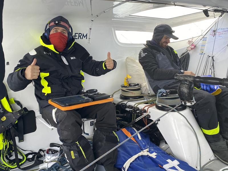 The Ocean Race 2022-23 Leg 3, Day 29 onboard Biotherm. Anthony Marchand and OBR Ronan Gladu trying to work in the cold weather photo copyright Ronan Gladu / Biotherm / The Ocean Race taken at  and featuring the IMOCA class