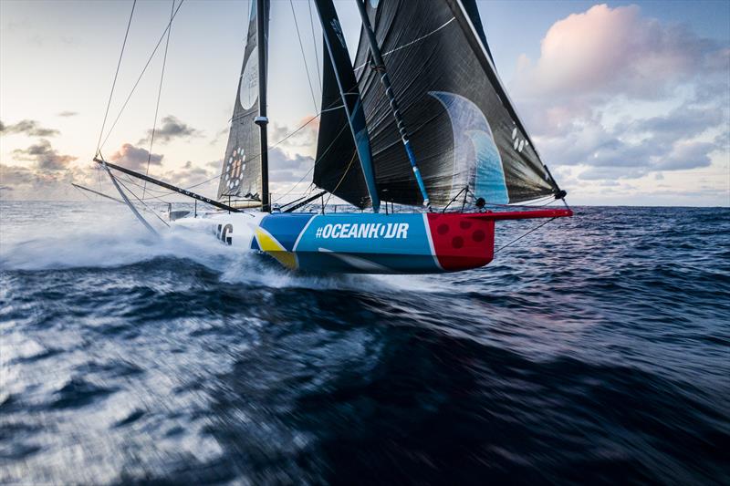 The Ocean Race 2022-23 Leg 3 Day 28 onboard 11th Hour Racing Team. Malama enjoys a rare Southern Ocean sunset photo copyright Amory Ross / 11th Hour Racing / The Ocean Race taken at  and featuring the IMOCA class