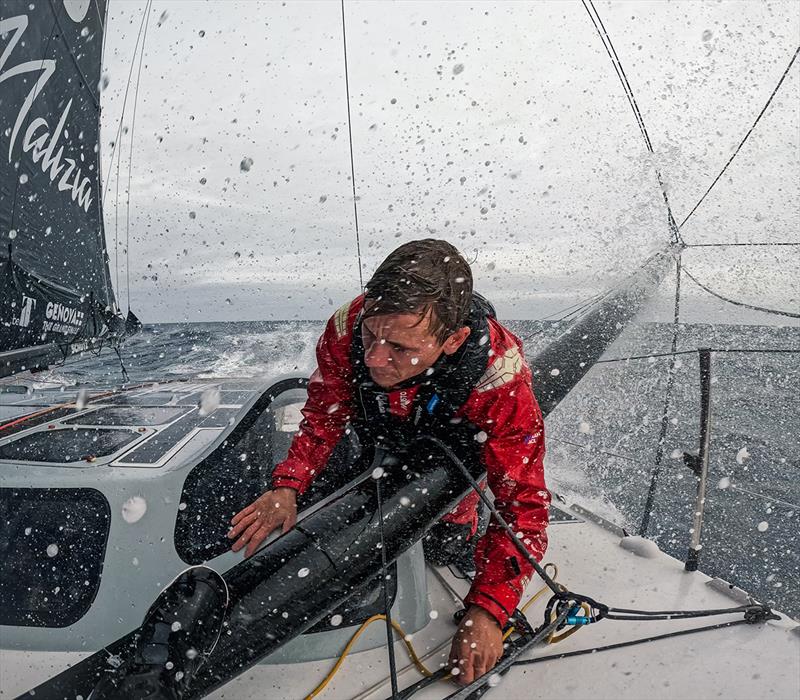 Will Harris changing sails in heavy weather photo copyright Malizia / Antoine Auriol taken at  and featuring the IMOCA class