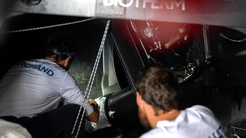 The Ocean Race 2022-23 - 3 April 2023, Leg 3 Day 37 onboard Biotherm. Anthony Marchand and skipper Paul Meilhat repairing the hull photo copyright Ronan Gladu / Biotherm / The Ocean Race taken at  and featuring the IMOCA class