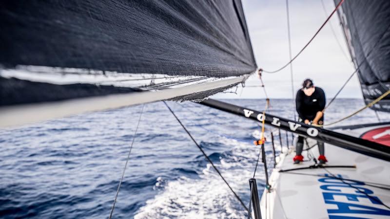 The Ocean Race 2022-23 - 03 April 2023, Leg 3 onboard 11th Hour Racing Team. The damaged foot of the J0 hangs in the wind as Justine Mettraux adjusts sheeting leads in the background - photo © Amory Ross / 11th Hour Racing / The Ocean Race