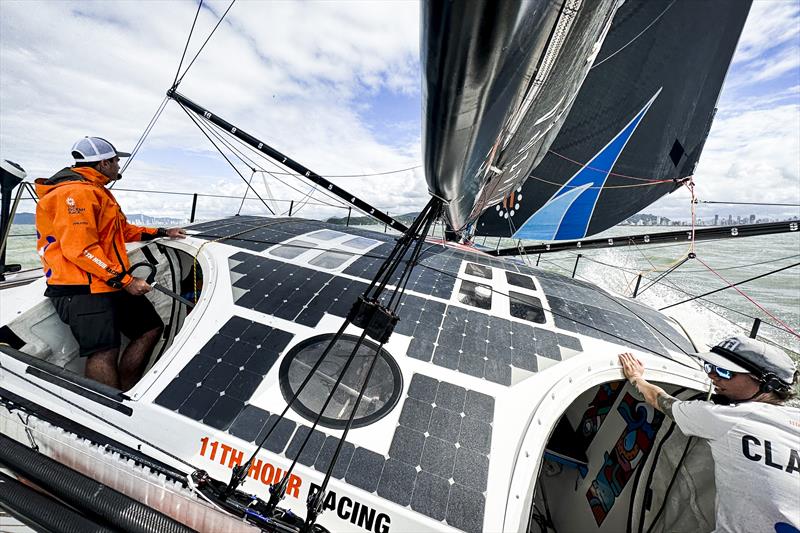 The Ocean Race 2022-23 -Leg 4 start onboard 11th Hour Racing Team. Charlie Enright and Francesca Clapcich split the cockpit hatches for good visibility outside the boat photo copyright Amory Ross / 11th Hour Racing / The Ocean Race taken at  and featuring the IMOCA class