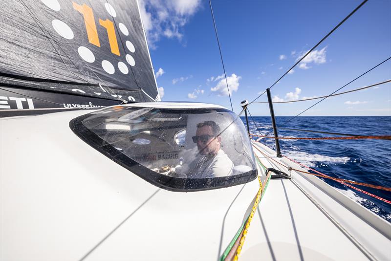 The Ocean Race 2022-23 Leg 4 onboard 11th Hour Racing Team. Charlie Enright in the bubble under a hot tropical sun photo copyright Amory Ross / 11th Hour Racing / The Ocean Race taken at  and featuring the IMOCA class