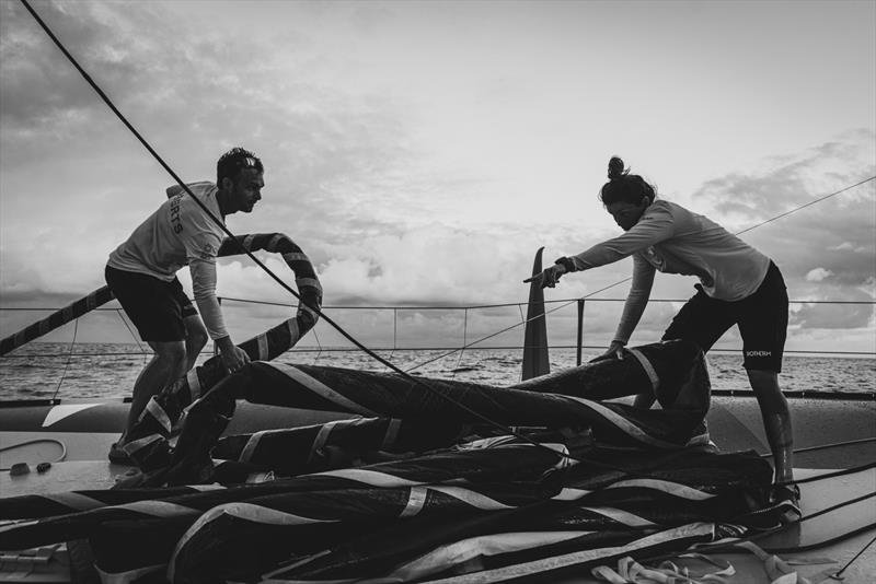 The Ocean Race 2022-23 Leg 4 onboard Biotherm. Alan Roberts and Mariana Lobato tiding the sail - photo © Anne Beauge / Biotherm / The Ocean Race