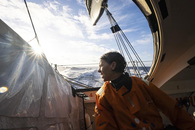 The Ocean Race 2022-23 - May 05 , Leg 4 Day 12 onboard 11th Hour Racing Team. Francesca Clapcich looks out through the aft hatch at sunrise - photo © Amory Ross / 11th Hour Racing / The Ocean Race