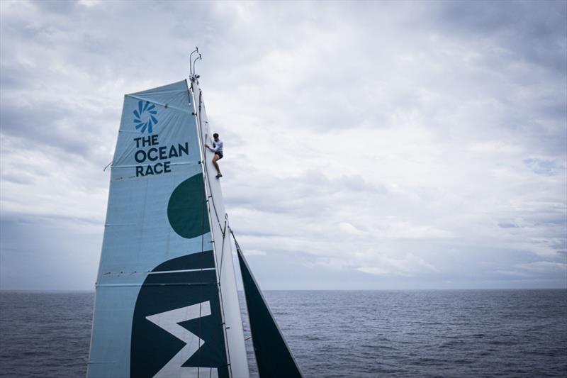 The Ocean Race 2022-23 - 6 May , Leg 4 Day 13 onboard Biotherm. Skipper Paul Meilhat on top of the mast to fix a little halyard problem, - photo © Anne Beauge / Biotherm / The Ocean Race