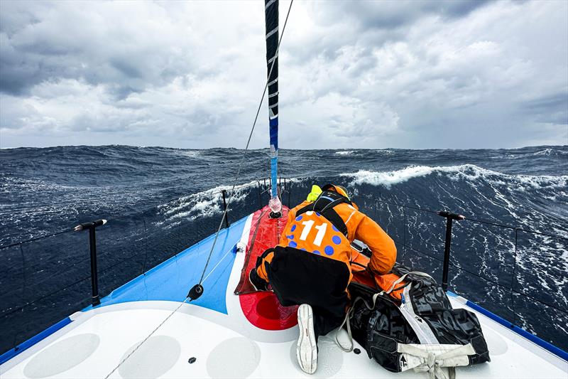 The Ocean Race 2022-23 - 8 May , Leg 4, Day 15 onboard 11th Hour Racing Team. Damian Foxall plugging in the storm jib in strong winds through the Gulf Stream photo copyright Amory Ross / 11th Hour Racing / The Ocean Race taken at  and featuring the IMOCA class