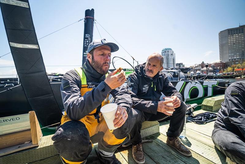 Relieved, the crew fell into each other's arms on land and had a first snack photo copyright GUYOT environnement - Team Europe taken at  and featuring the IMOCA class