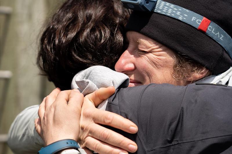 Relieved, the crew fell into each other's arms on land and had a first snack photo copyright GUYOT environnement - Team Europe taken at  and featuring the IMOCA class