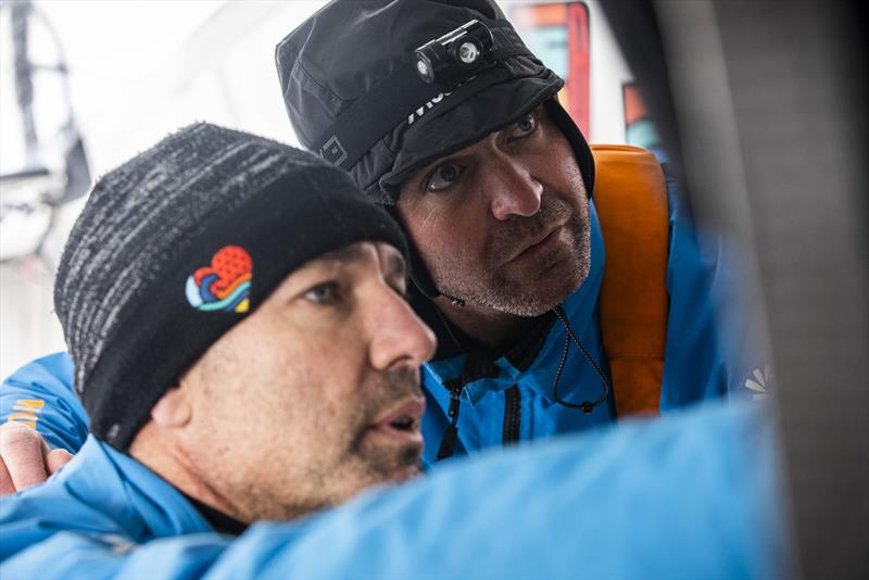 The Ocean Race 2022-23 - May 24, Leg 5 Day 3 onboard 11th Hour Racing Team . Malama enjoying flatter, calmer seas in the North Atlantic. Charlie Enright and Simon Fisher work through the options with a download of new weather information - photo © Amory Ross / 11th Hour Racing / The Ocean Race