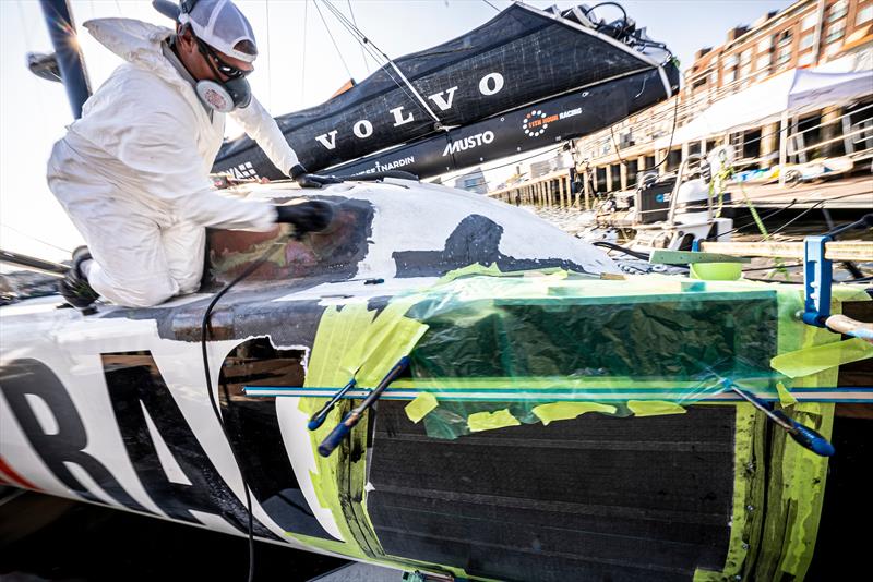 The 11th Hour Racing Team continues repairs after a collision during the start of Leg 7 photo copyright Amory Ross / 11th Hour Racing Team taken at New York Yacht Club and featuring the IMOCA class