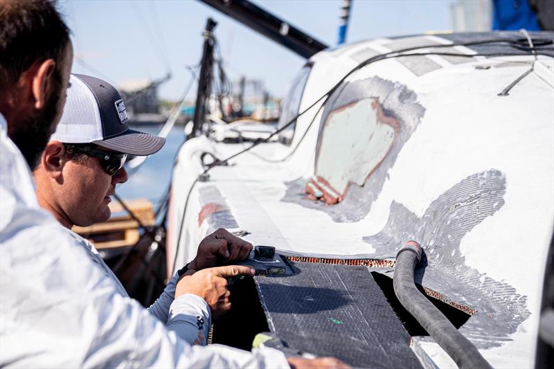 The 11th Hour Racing Team continues repairs after a collision during the start of Leg 7 - photo © Amory Ross / 11th Hour Racing Team