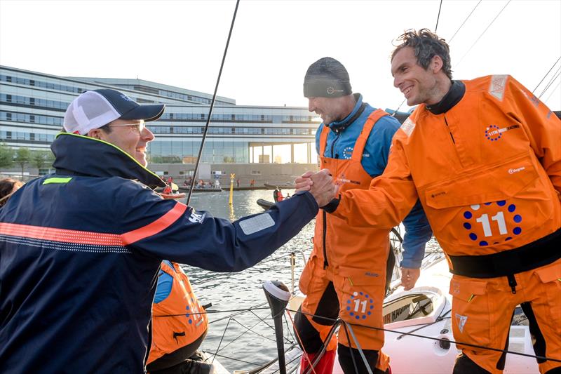 The Ocean Race 2022-23 - 29 May 2023. Arrivals in Aarhus, Denmark. The Ocean Race Chairman Richard Brisius congratulates Charlie Dalin for the 11th Hour Racing Team's first place in Leg 5 photo copyright Sailing Energy / The Ocean Race taken at  and featuring the IMOCA class