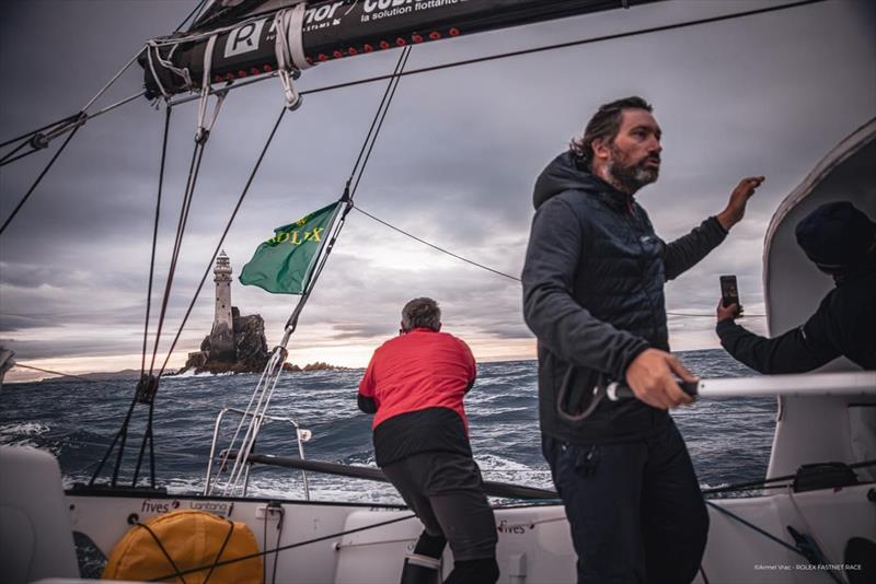 A quick photo of the rock in passing - IMOCA class in the Rolex Fastnet Race - photo © Armel Vrac