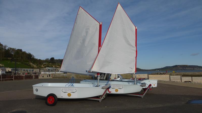 Three Optimists for Lyme Regis Sailing Club from the John Merricks Sailing Trust photo copyright Dave Stubbs taken at Lyme Regis Sailing Club and featuring the Optimist class