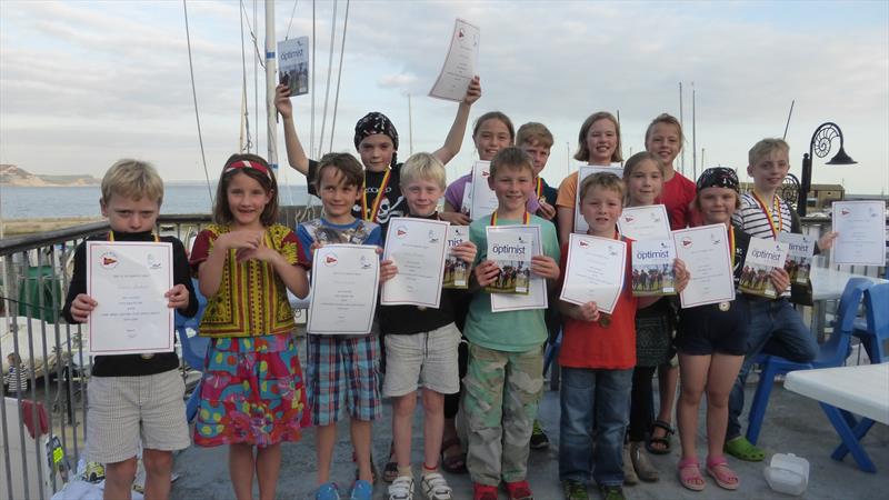 Three Optimists for Lyme Regis Sailing Club from the John Merricks Sailing Trust photo copyright Dave Stubbs taken at Lyme Regis Sailing Club and featuring the Optimist class