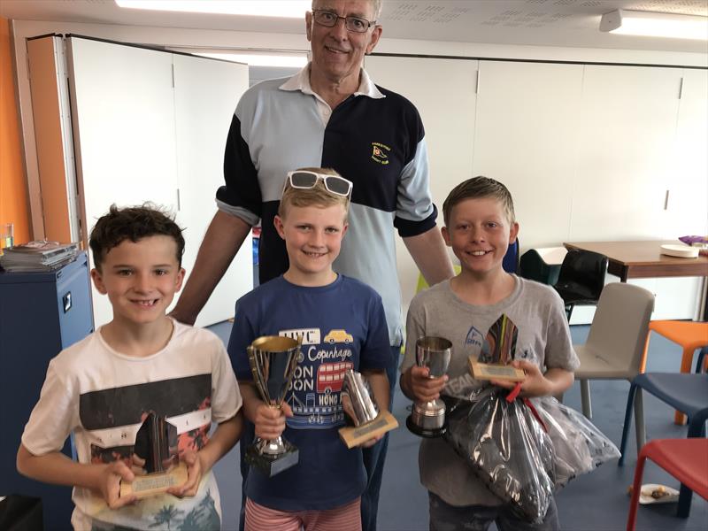 Parkstone Optimist Open winners Barney Bromilow, Tom Hakes and Henry Keegan with Parkstone Commodore Rob Jarrett photo copyright Roger Hakes taken at Parkstone Yacht Club and featuring the Optimist class