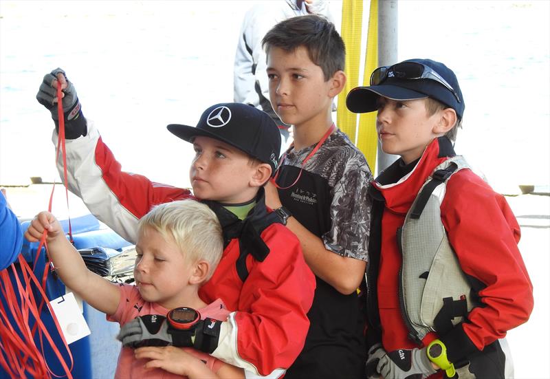 Green Rainbow fleet signing on. QCYC using a numbered card with Lanyard system, which has been extremely successful both with the InterIslander and these Nationals Day 3 - Toyota NZ Optimist National Championships - April 2, 2018  - photo © Christel Hopkins