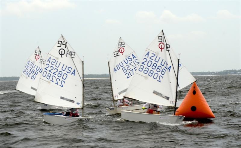 With a Southwesterly settling in at 10-15 knots, races were hard fought again on the final day. In the finals Lauderdale Yacht Club (90's) defeated Long Island Sound 3-2 to take the top prize and earn an invitation to Germany for racing in October photo copyright Talbot Wilson taken at Pensacola Yacht Club and featuring the Optimist class