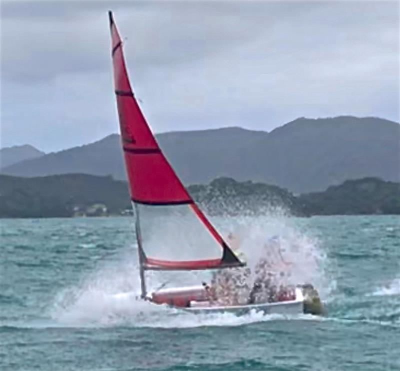 O-Pro's bow working hard to lift in a squall photo copyright Mattie Mason taken at  and featuring the Optimist class