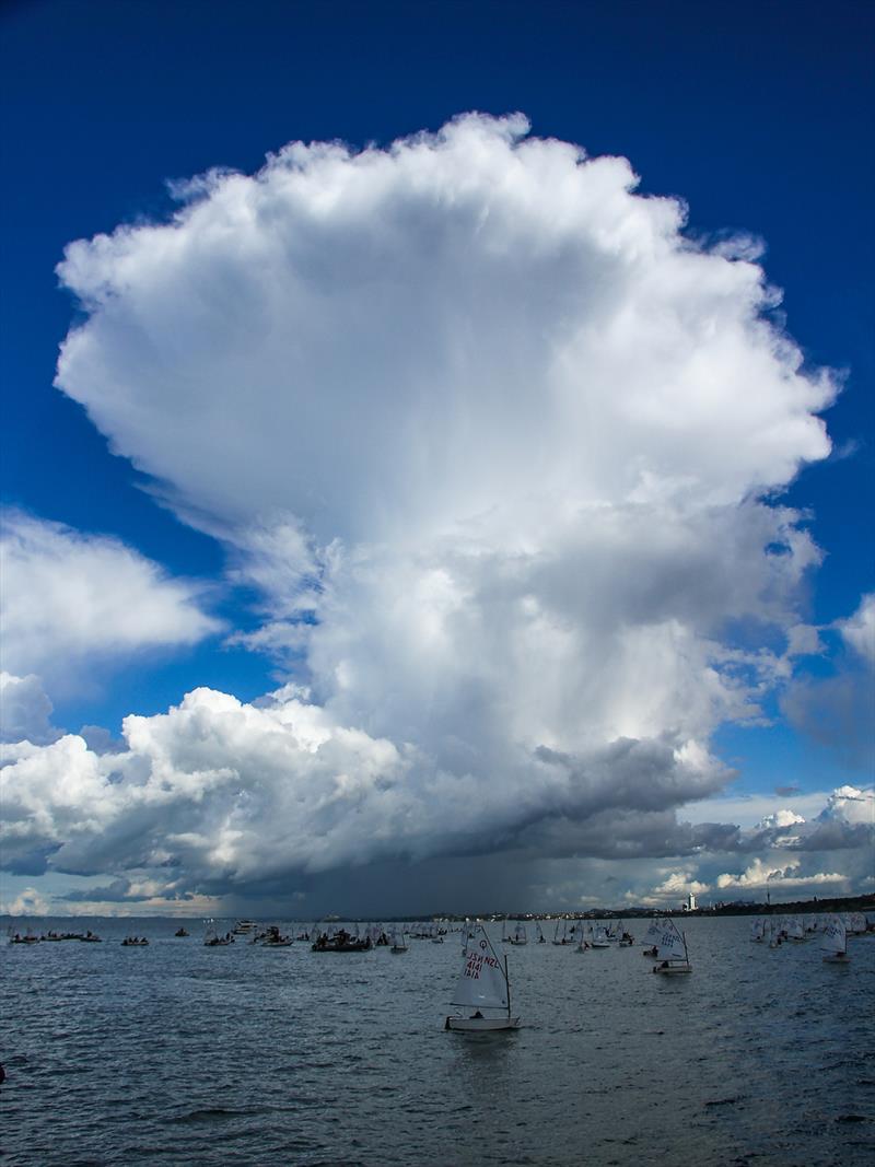 Thunderheads moved across the race course without creating the havoc that hit Auckland's suburbs - 2019 Toyota NZ Optimist Nationals Day 5, April 2019 - Murrays Bay SC photo copyright Richard Gladwell taken at Murrays Bay Sailing Club and featuring the Optimist class