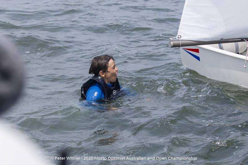 Joel Beashel celebrating with a swim after an emphatic national title victory - 2020 Musto Optimist Australian and Open Championship photo copyright Peter Withiel taken at Royal Yacht Club of Victoria and featuring the Optimist class