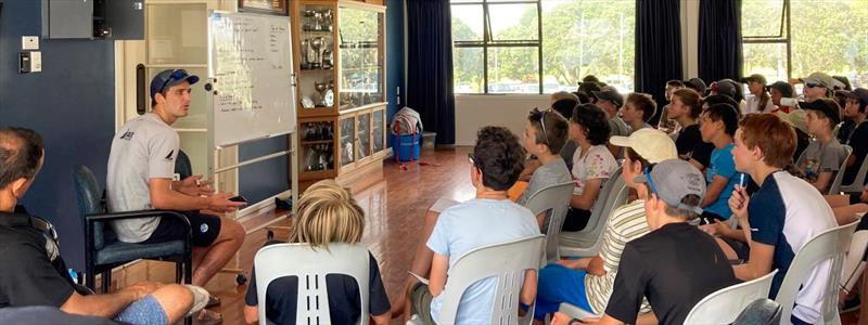 World Laser Champion, Tom Saunders gives some tips to a class of 72 Opti sailors at Wakatere BC photo copyright Yachting NZ taken at Wakatere Boating Club and featuring the Optimist class