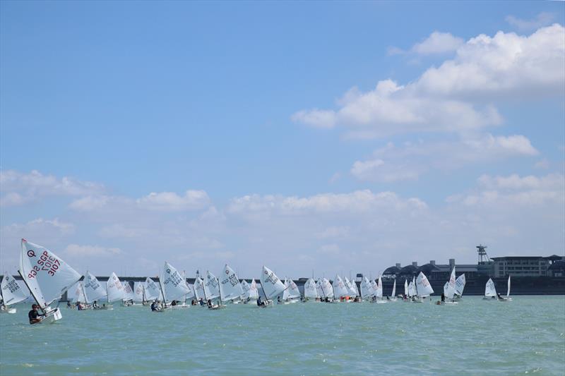 Blue skies and fair winds, a great day to race - Raffles Marina Optimist Regatta 2022 photo copyright Raffles Marina taken at Singapore Sailing Federation and featuring the Optimist class