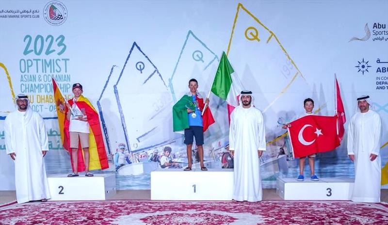Italy's gold medal winner Mattia Di Martino on the podium with Joan Domingo (left) who claimed the silver and Turkey's Mehmet Erkut Budak who took the bronze at the 2023 Optimist Asian and Oceanian Championship - photo © Craig Strydom