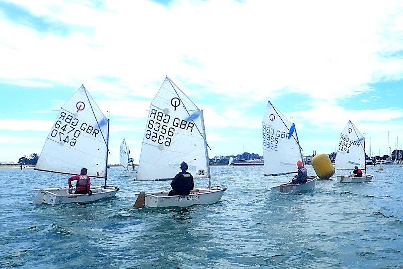 Layline action at the windward mark - Red Ribbon Regatta at Hayling Island photo copyright Melvyn Cooper taken at Hayling Island Sailing Club and featuring the Optimist class