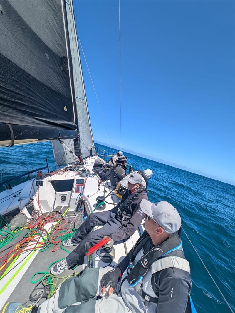 The crew of The Jackal cruising at 8-12 knots outside Port Phillip Heads photo copyright Matt Setton taken at Ocean Racing Club of Victoria and featuring the ORC class