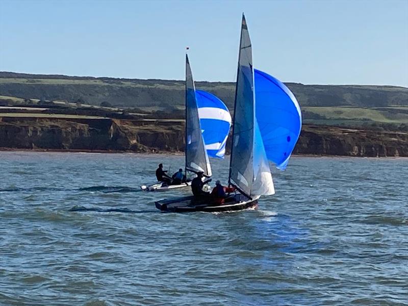 Osprey Round the Isle of Wight Race - Two of the fleet on the south of the island taken from the mother ship photo copyright Ros Downs taken at Lymington Town Sailing Club and featuring the Osprey class