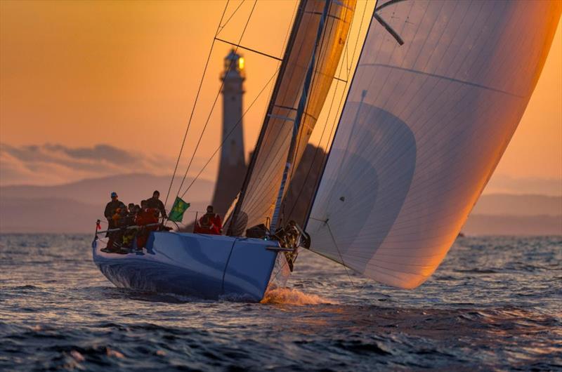 Chris Sheehan's American PAC 52 Warrior Won was an impressive sight as she rounded the Fastnet Rock at dawn in the recent Rolex Fastnet Race - photo © Rolex / Kurt Arrigo