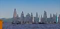 Fleet approaching the start with contest winner Rohan Nicol # 3145 mid fleet closely shadowed by runner up, Hayden Percy # 3157 © Russell Witt Photography