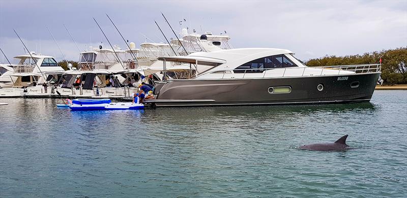 A local drops in briefly to join the Gold Coast mega raft-up revellers. - photo © Riviera