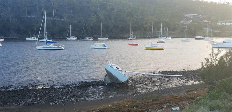 A small yacht, dismasted and washed ashore on the eastern shore of the River Derwent - photo © Peter Campbell