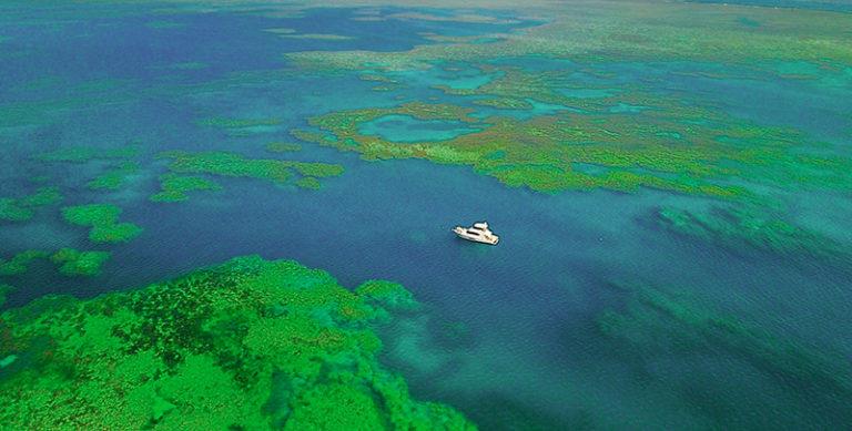Anchored at Bait Reef, Great Barrier Reef photo copyright Riviera Australia taken at  and featuring the Power boat class