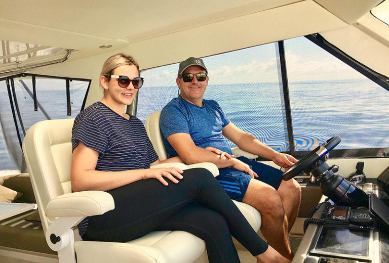 Russell and Gabriella at the helm. - photo © Riviera Australia