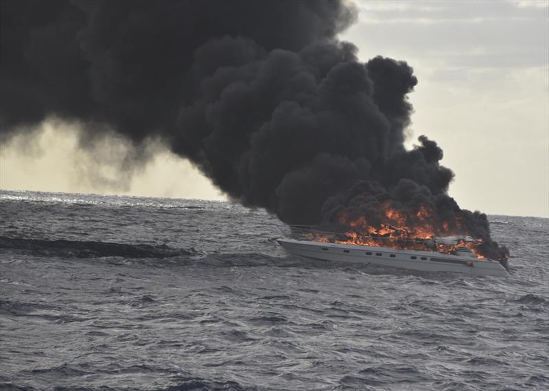 The pleasure craft, Family Time, sits in the water on fire approximately 30 miles east of Miami Beach, Friday, Dec. 7, 2018. The Coast Guard Cutter Robert Yered (WPC-1104) responded to the vessel on fire to assist the survivors photo copyright Petty Officer 2nd Class Jonathan Lally taken at  and featuring the Power boat class