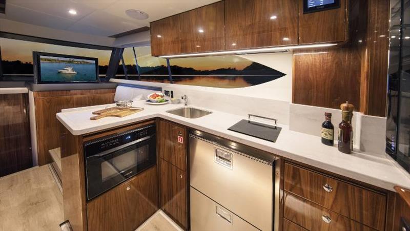 Riviera 39 Open Flybridge Galley - Gloss walnut timber finish photo copyright Riviera Australia taken at  and featuring the Power boat class