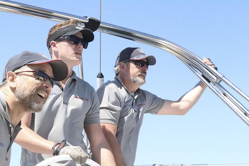 Sean, Andy and Bavaria Yachts Germany rep Marian Scheer at Hamilton Island Race Week photo copyright Ensign Yacht Group taken at  and featuring the Power boat class